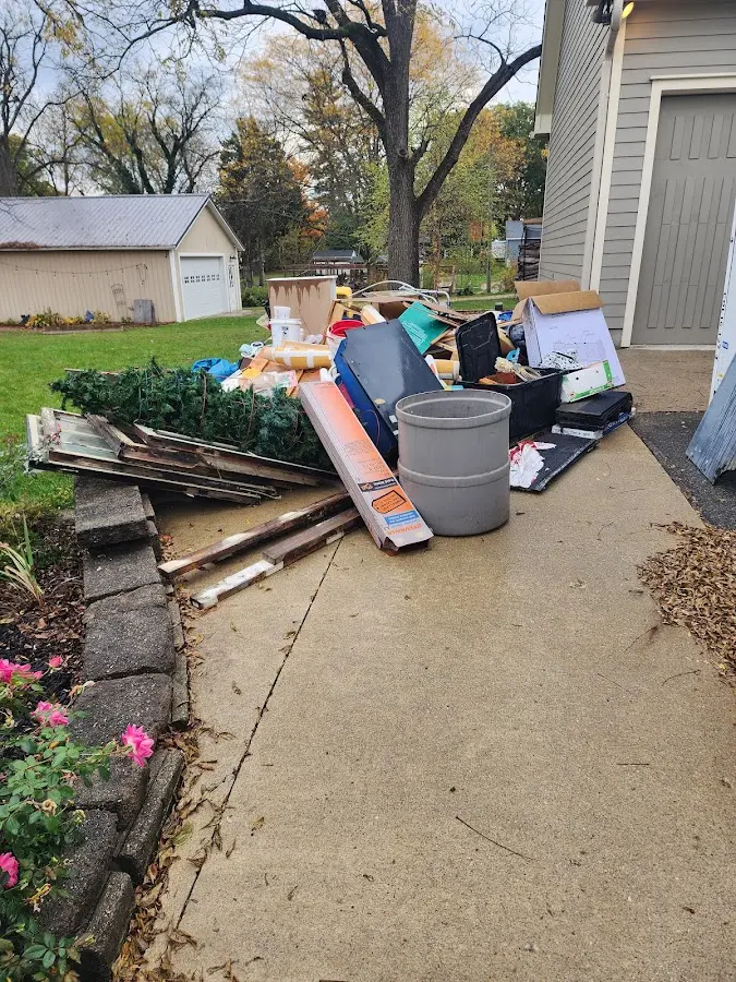 Dumpster being loaded with debris for Residential Dumpster Rental in Polson